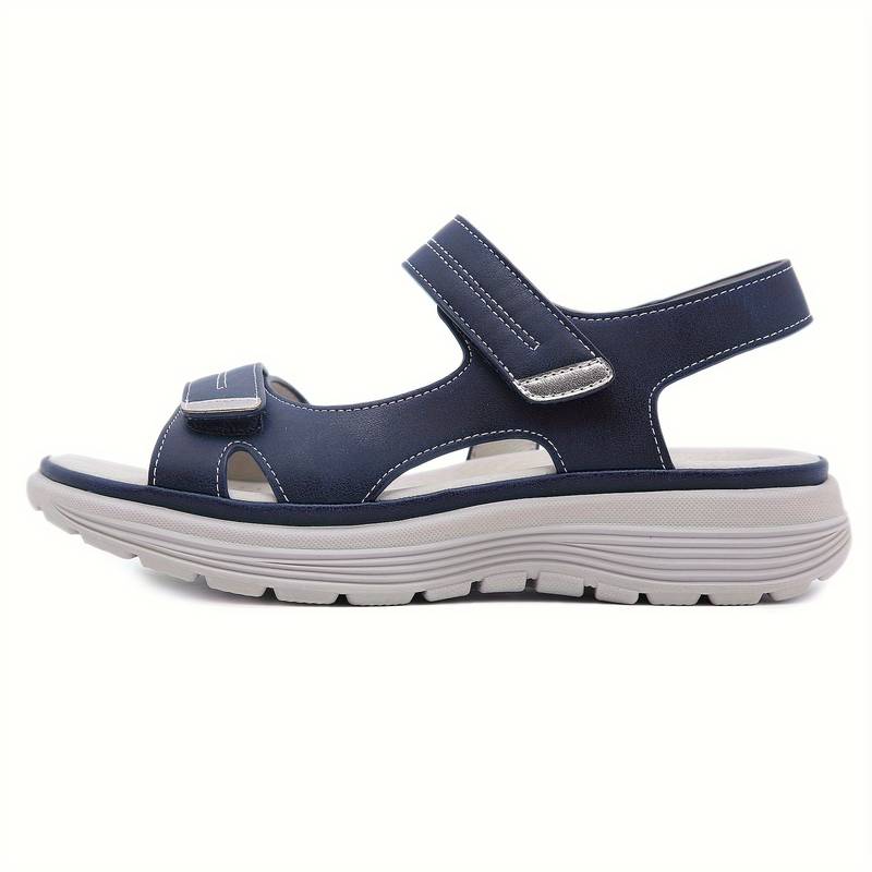 Damen-Sandale in Blau mit Klettverschluss, bequeme Sohle, ideal für Sommer und Freizeit. Perfekt für stilvolle und komfortable Alltagslooks.