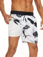 Herren-Badeshorts mit tropischem Muster, weiß-schwarz, Handyfach, Sommermode.