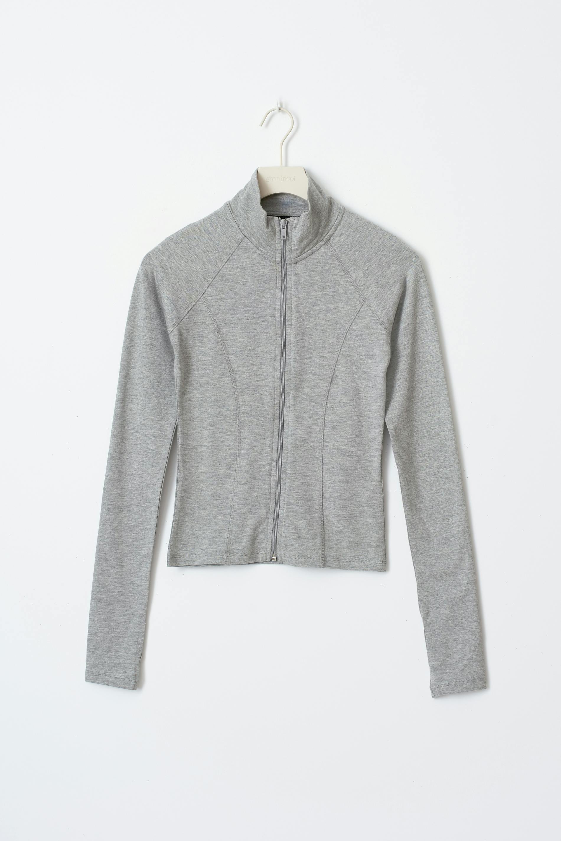Graues Damen-Trainingsjacke mit Reißverschluss, langärmelig, aus atmungsaktivem Material. Perfekt für Sport und Freizeit.