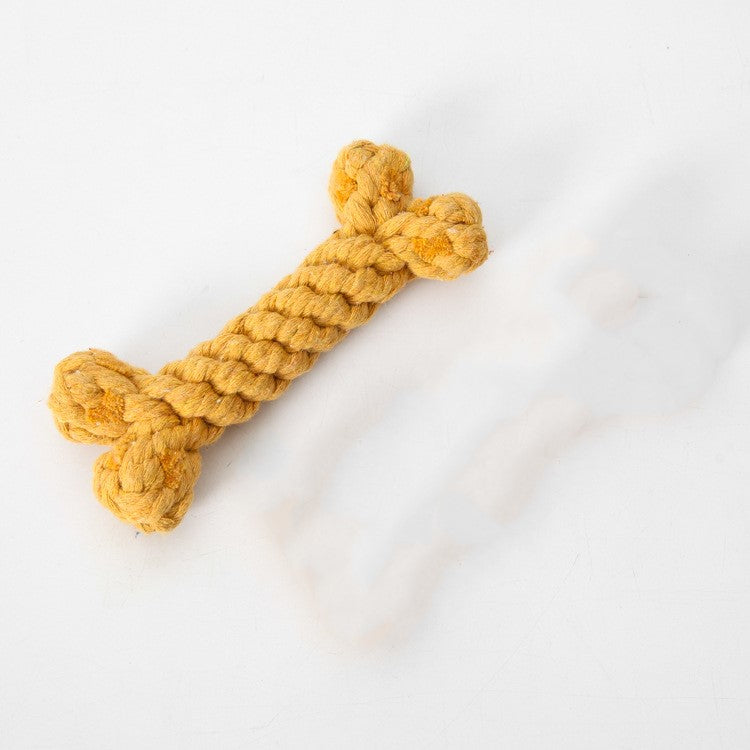 Gelbes Hundespielzeug aus Seil in Knochenform, ideal für Kauspielzeug und Zahnpflege. Robustes Material, perfekt für aktive Hunde.