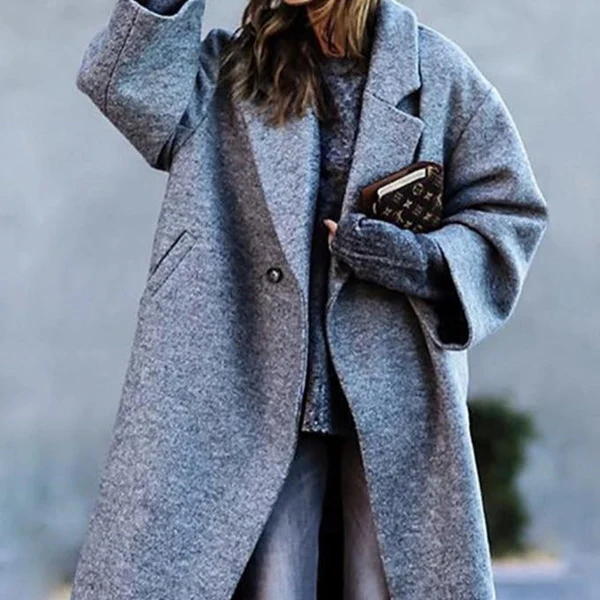 Damenmode: Eleganter grauer Wollmantel, oversized, mit Knopfverschluss. Perfekt für Herbst und Winter. Stilvoll und warm für kalte Tage.