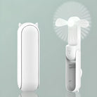 Weißer tragbarer Mini-Ventilator mit Tierohren, USB-aufladbar, kompakt und faltbar.