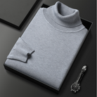 Grauer Rollkragenpullover aus Kaschmir in Geschenkbox, luxuriös und stilvoll. Perfekt für Herrenmode, Wintermode, elegantes Design.