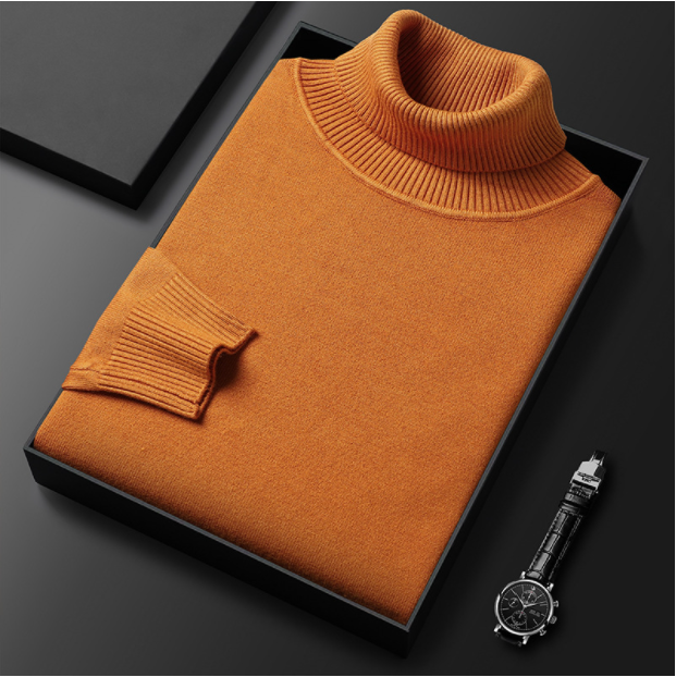 Eleganter orangefarbener Rollkragenpullover aus Kaschmir, stilvoll gefaltet in einer Geschenkbox, ideal für Herbstmode. Hochwertige Strickware.