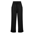 Schwarze Damenhose mit weitem Bein, elastischem Bund und Kordelzug. Perfekt für Freizeit und Büro. Bequeme, stilvolle Damenmode.