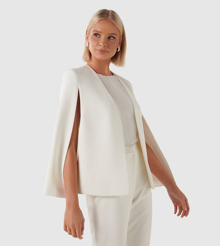 Eleganter weißer Damen-Cape-Blazer, ärmellos, ideal für formelle Anlässe. Modernes Design, hochwertige Verarbeitung, stilvoll und zeitlos.
