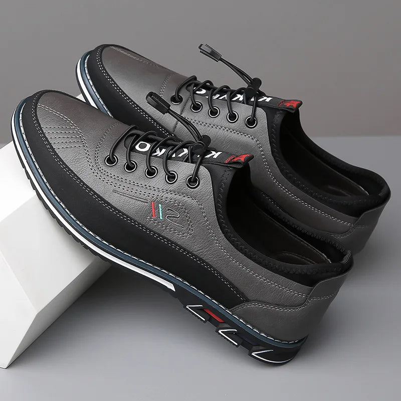 Graue Herrenschuhe aus Leder, sportlich-elegant, mit rutschfester Sohle und Schnürung. Perfekt für Freizeit und Business. Hochwertige Verarbeitung.