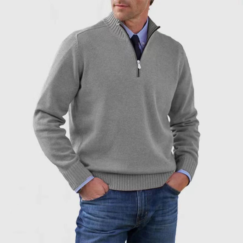 Grauer Herrenpullover mit Reißverschluss, elegantes Design, ideal für Herbst und Winter. Perfekt kombinierbar mit Jeans für einen lässigen Look.