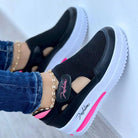 Damen Sneaker, schwarz-weiß, atmungsaktiv, mit Mesh-Obermaterial und runder Spitze. Bequeme Freizeitschuhe, ideal für Laufen und Alltag.