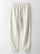 Beige Leinenhose mit elastischem Bund, lässiger Passform und aufgesetzter Gesäßtasche. Perfekt für Sommermode und Freizeitkleidung.