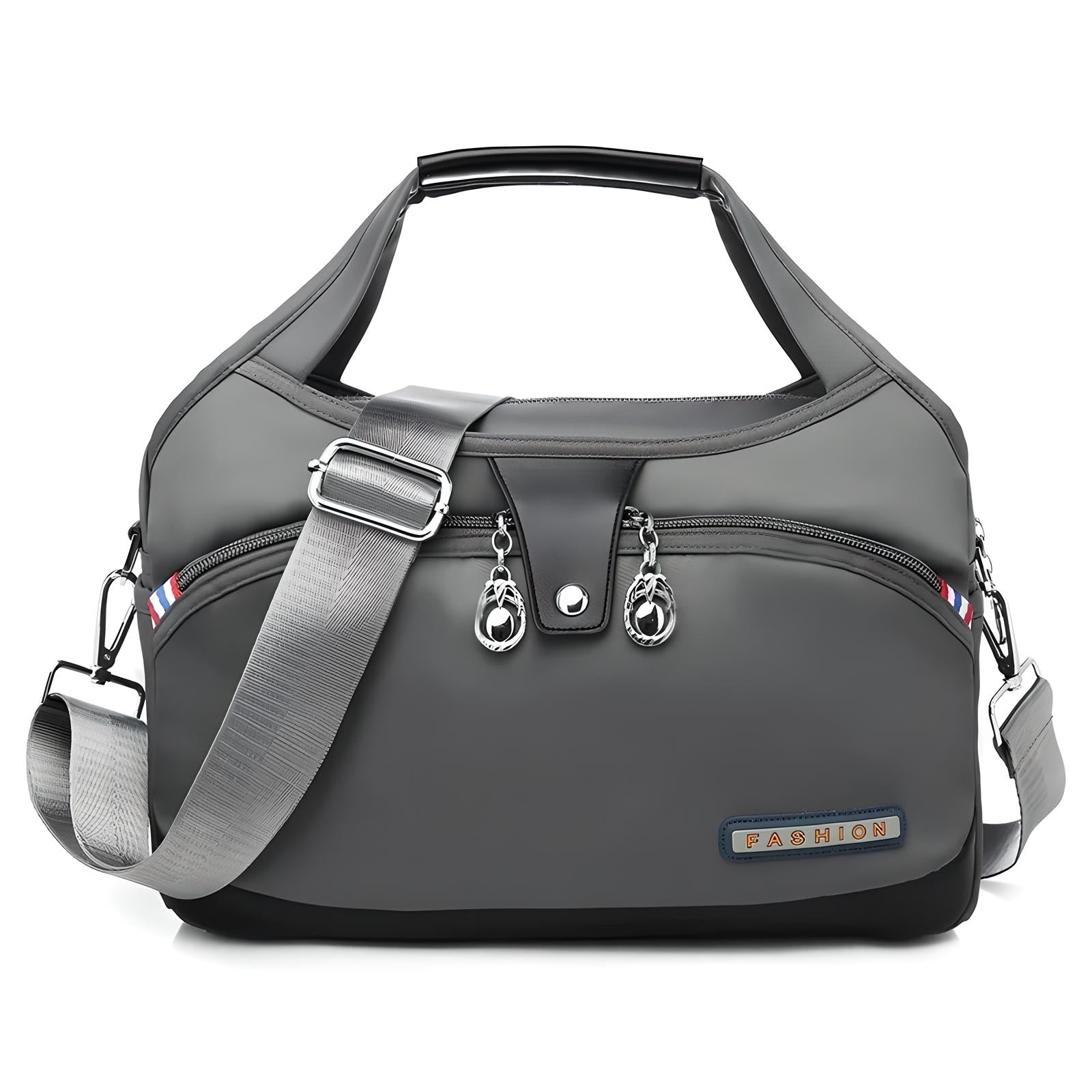 Graue Damenhandtasche mit verstellbarem Schultergurt, Reißverschlüssen, modisches Design.