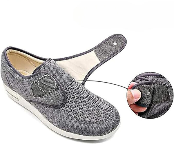 Bequemer grauer Damen-Slipper mit Klettverschluss, ideal für Alltag und Freizeit. Atmungsaktives Material, rutschfeste Sohle, modisches Design.