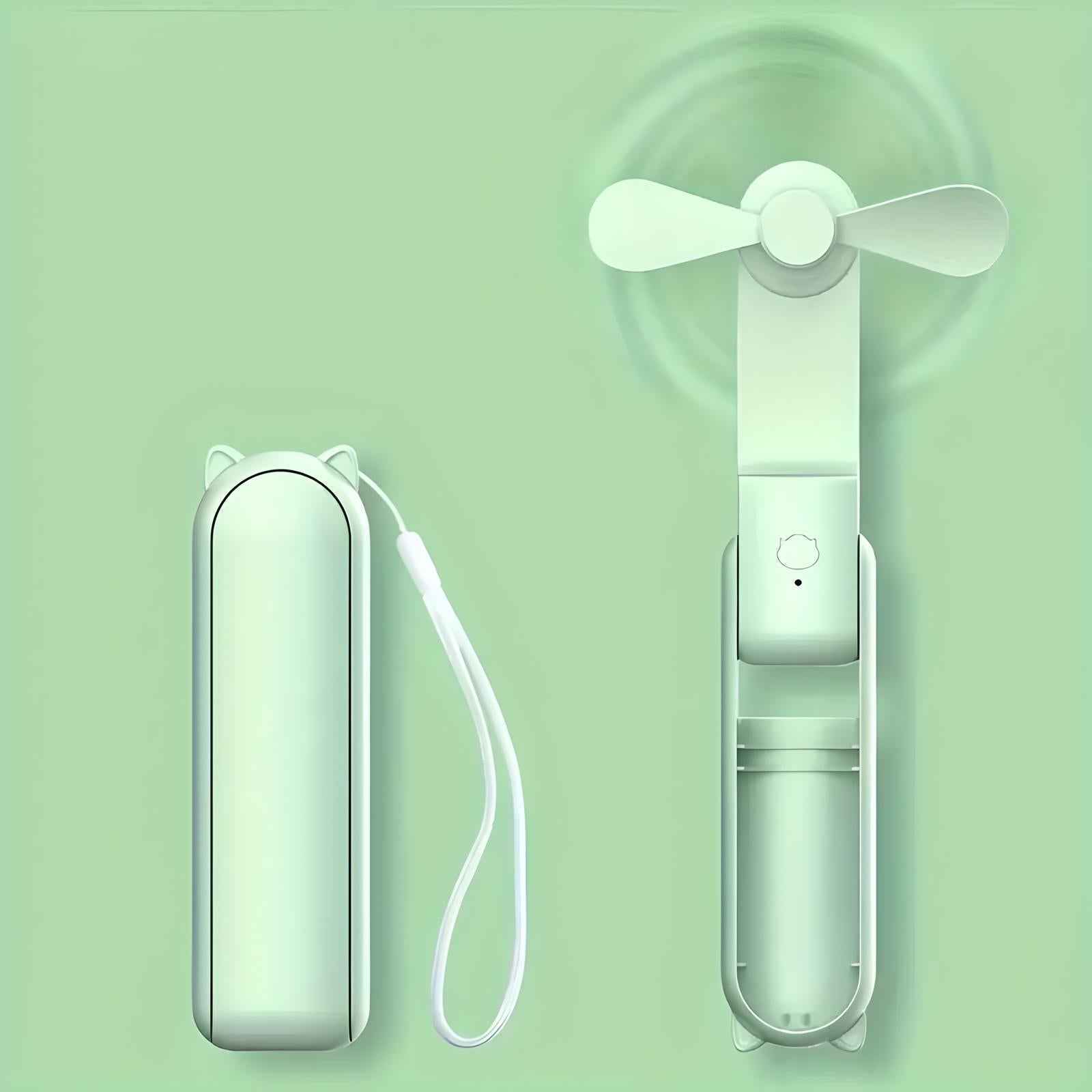 Tragbarer grüner Mini-Ventilator mit USB-Ladefunktion und Handgelenkschlaufe, kompakt und faltbar.