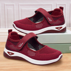 Bequeme, atmungsaktive Damen-Sneaker in Rot mit Klettverschluss, ideal für Freizeit und Sport. Leichte, rutschfeste Sohle für optimalen Halt.