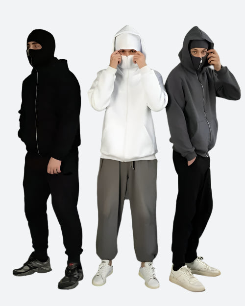 Drei Männer in schwarzen, weißen und grauen Hoodies und Jogginghosen, modische Streetwear.