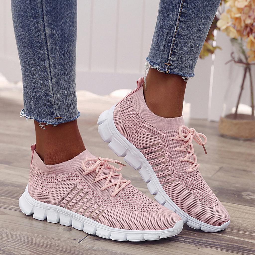 Damen Sneaker in Rosa, atmungsaktiv und bequem, ideal für Freizeit und Sport. Modische Strickoptik, rutschfeste Sohle, trendige Wahl.