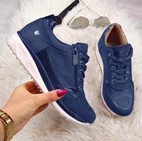 Blaue Damen-Sneaker mit Reißverschluss und Schnürsenkeln, stilvoll und bequem, ideal für Freizeit und Sport. Perfekt für modische Outfits.