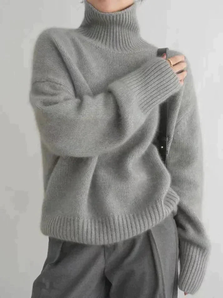 Graue Kaschmir-Rollkragenpullover für Damen, Herbst/Winter 2023. Weicher, lockerer Strick, 100% Wolle, modisch und warm.