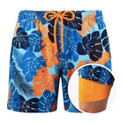Bunte Herren-Badeshorts mit tropischem Blattmuster, blau-orange, elastischer Bund.