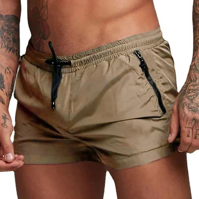 Herren-Badeshorts mit Reißverschlusstaschen, Mesh-Futter, schnell trocknend, ideal für Sommer und Strand. Bequeme und stilvolle Badebekleidung.