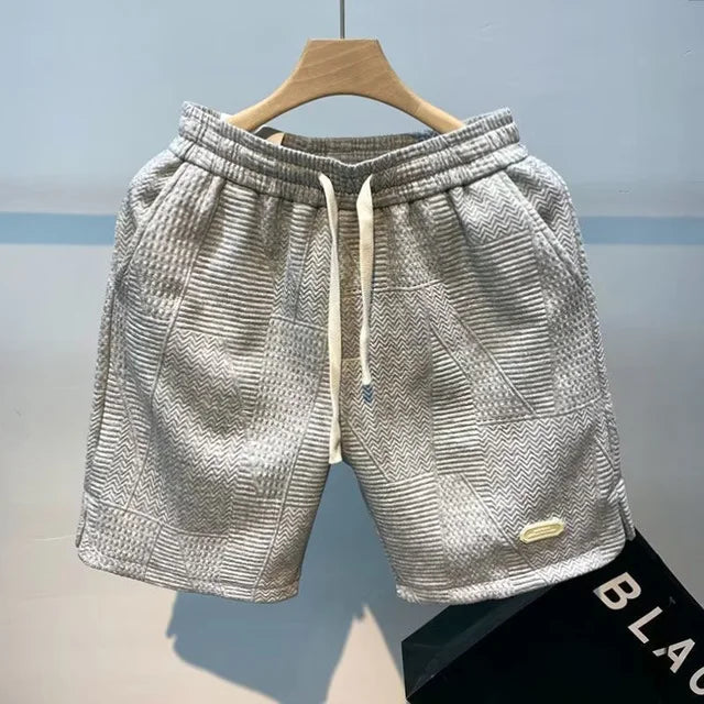 Graue Herren-Shorts aus Eisseide, schnell trocknend, atmungsaktiv, ideal für Sport im Sommer.