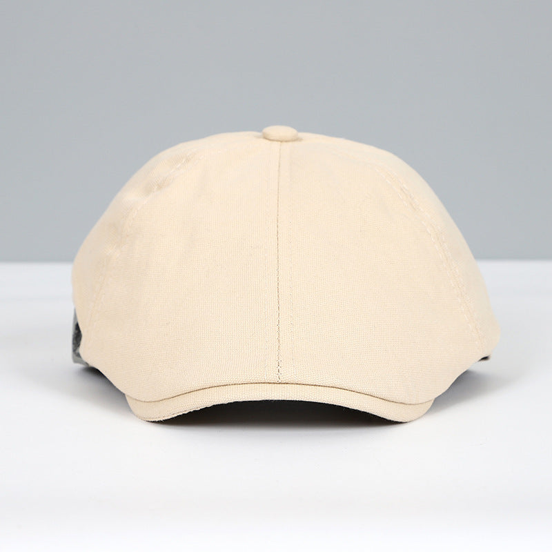 Beige Schiebermütze aus Baumwolle, klassisches Design, ideal für Herrenmode. Perfekt für stilvolle Outfits und zeitlosen Look.