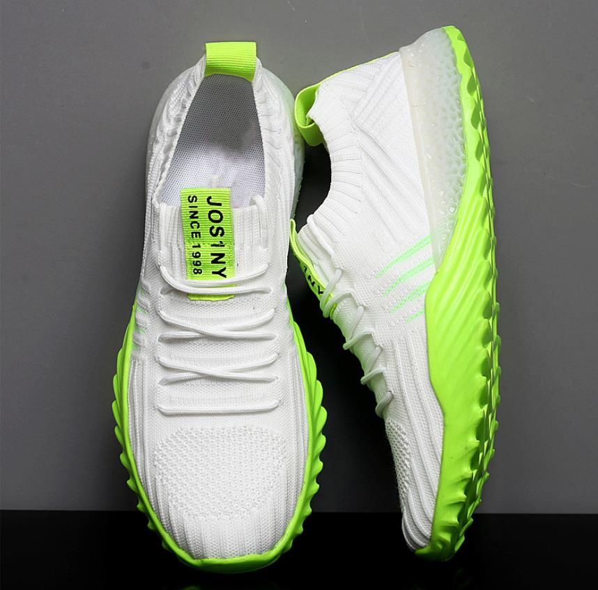Weiße Sneaker mit neongrüner Sohle, atmungsaktives Mesh, sportliches Design, Herrenmode.