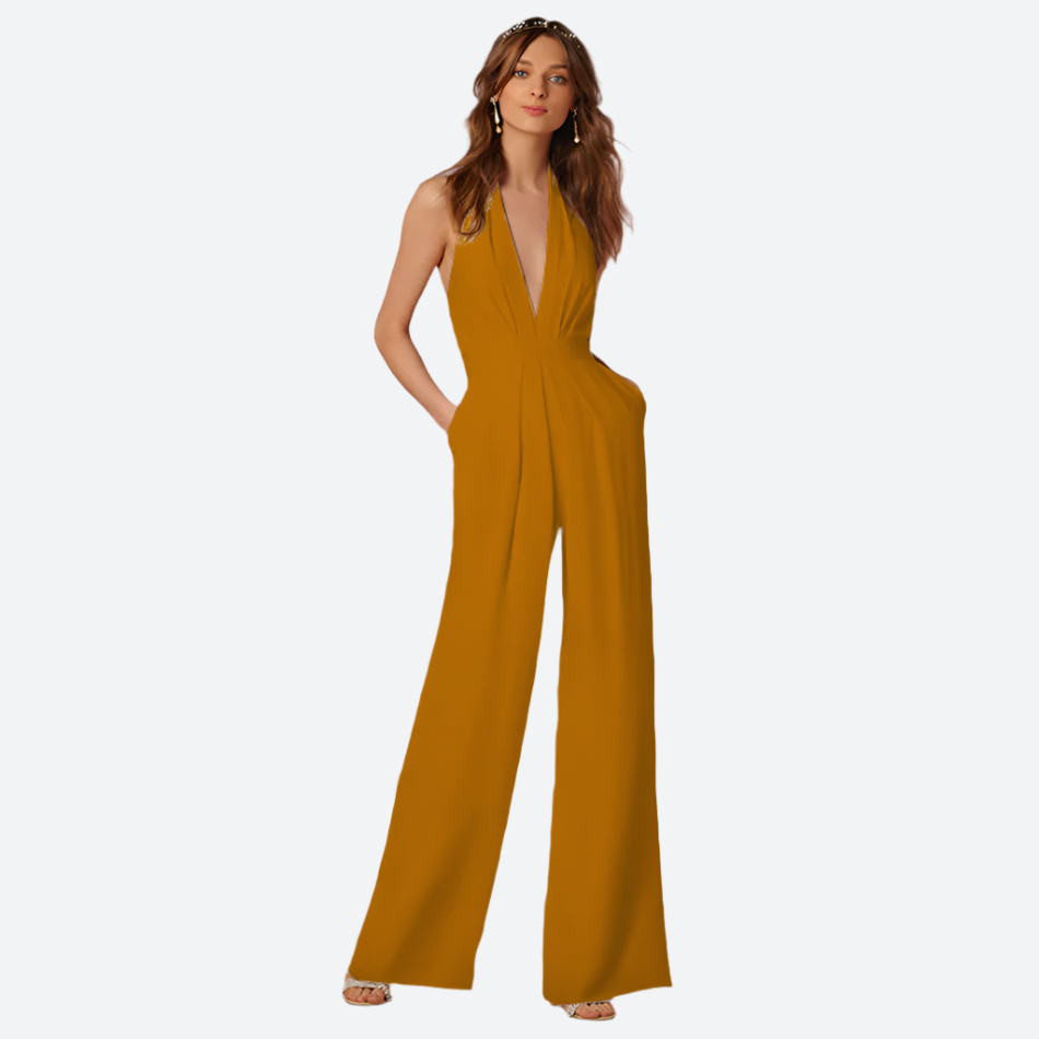 Frau in senfgelbem Jumpsuit, ärmellos, elegantes Design, Mode, Abendkleidung, rosa Hintergrund.