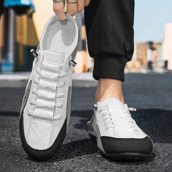 Weiße Herren-Sneaker mit offener Ferse, bequemem Design und schwarzem Akzent. Perfekt für Freizeit und Sport. Ideal für stilbewusste Männer.