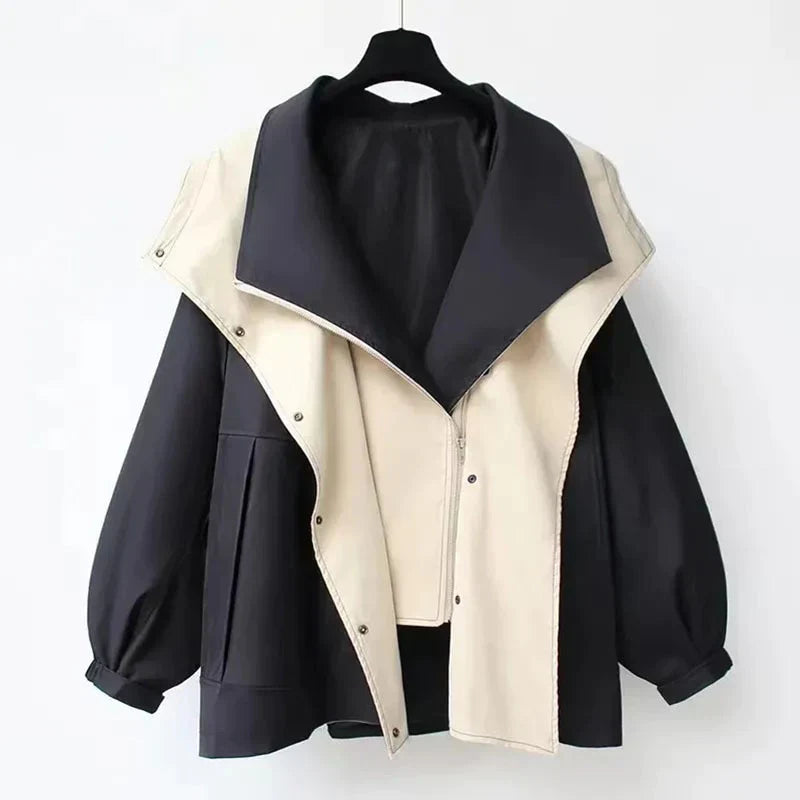 Schwarze und weiße Damenjacke mit weitem Kragen, modisch und elegant, ideal für Herbstmode. Hochwertige Materialien, stilvolles Design.