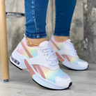 Damen-Sneaker in Pastellfarben, modisch und bequem, ideal für Freizeit und Sport. Trendige Turnschuhe mit Regenbogen-Design und weißer Sohle.