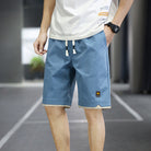 Herren-Sportshorts blau, atmungsaktiv, ideal für Sommer-Fitness, urbaner Stil.