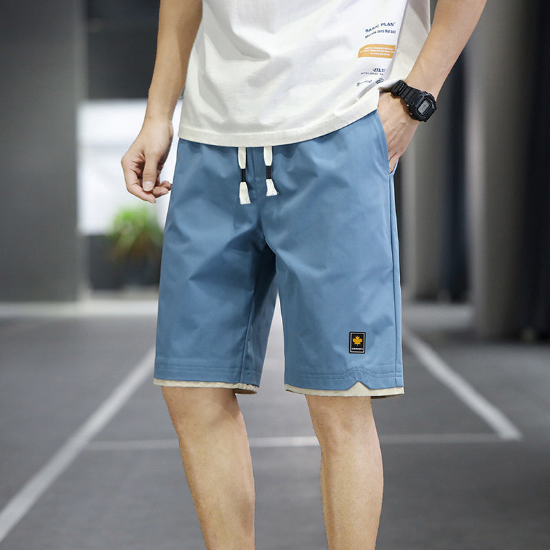 Herren-Sportshorts blau, atmungsaktiv, ideal für Sommer-Fitness, urbaner Stil.