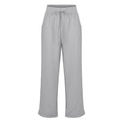 Graue Damenhose aus Leinen mit elastischem Bund und Kordelzug, ideal für Sommermode. Bequeme, luftige Passform für lässigen Stil.