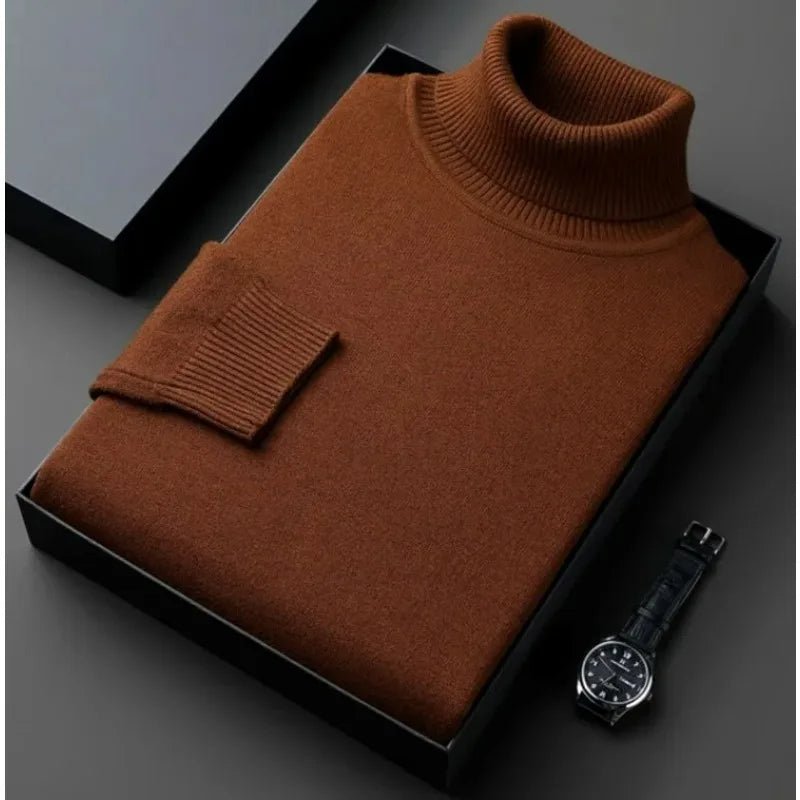 Brauner Rollkragenpullover aus feiner Wolle, elegant gefaltet in einer Geschenkbox. Perfekt für stilvolle Herbst- und Wintermode.