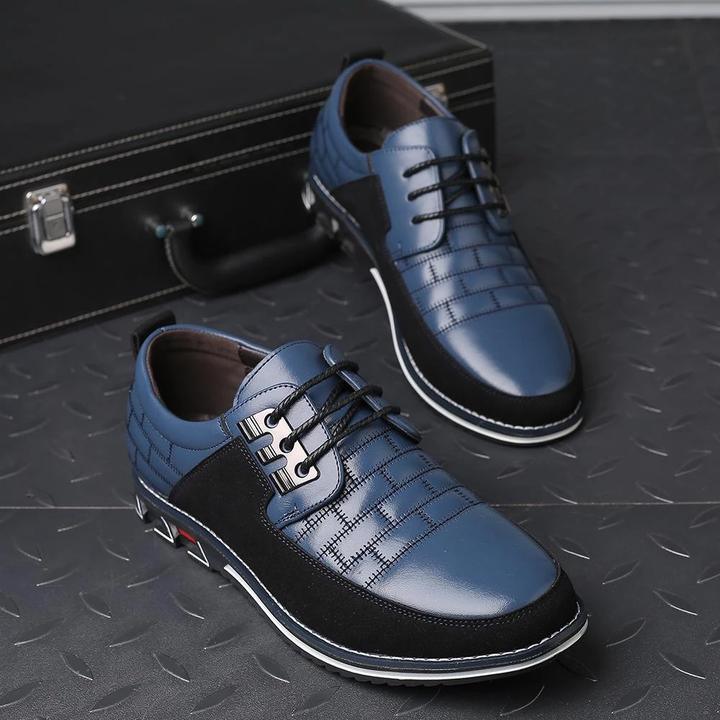 Elegante blaue Herrenschuhe aus Leder mit schwarzem Akzent, ideal für Business und Freizeit. Hochwertige Verarbeitung, stilvoll und modern.