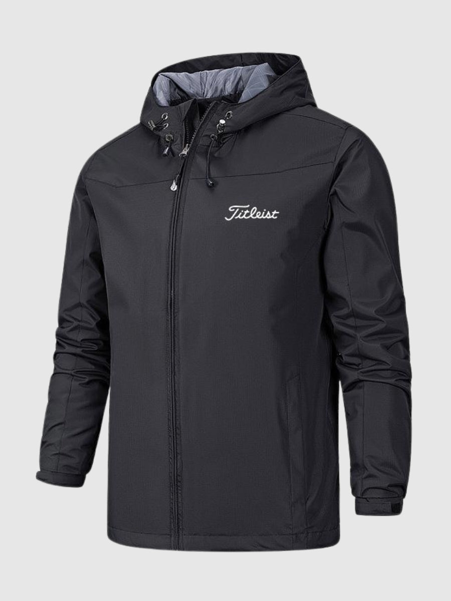 Titleist Connor wasserdichte Jacke, schwarz, mit Kapuze und Reißverschluss. Perfekt für Outdoor-Aktivitäten, Golfbekleidung, wetterfest.