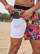 Bunte Herren-Badeshorts mit Smartphone-Tasche, Strandmode, Blumenmuster, bequem, praktisch.