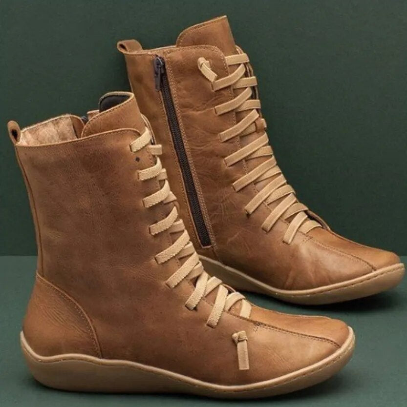 Damenstiefel aus braunem Leder mit Schnürung und Reißverschluss, modisch und bequem, ideal für Herbst und Winter. Hochwertige Materialien.