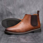 Hochwertige braune Chelsea Boots aus Leder für Herren, rutschfeste Sohle, elegantes Design, ideal für Business und Freizeit.