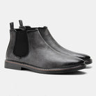 Schwarze Chelsea Boots aus Lederimitat, stilvoll und modern, ideal für Herrenmode. Perfekt für elegante und lässige Anlässe.