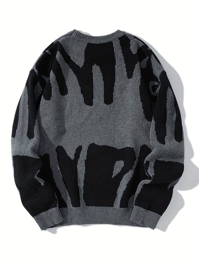 Grauer Strickpullover mit abstraktem schwarzem Muster, modisch und warm, ideal für Herbst und Winter. Hochwertige Herrenmode, bequem und stilvoll.