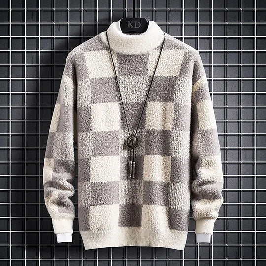 Kariertes Strickpullover in Grau und Weiß, weiches Material, Rollkragen, modisches Design, ideal für Herbst und Wintermode.