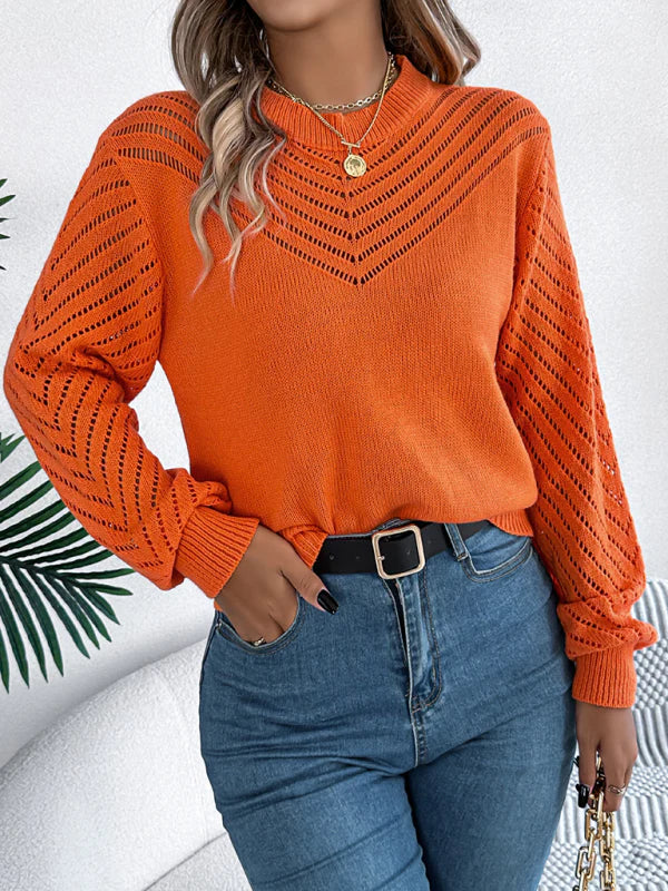 Damenpullover in leuchtendem Orange, gestrickt mit V-Ausschnitt-Muster. Perfekt für Herbstmode, kombiniert mit blauer Jeans und modischen Accessoires.