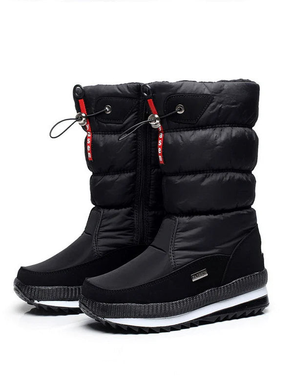 Schwarze Winterstiefel für Damen, wasserdicht, mit rutschfester Sohle und warmem Futter. Ideal für kalte Wetterbedingungen und Outdoor-Aktivitäten.