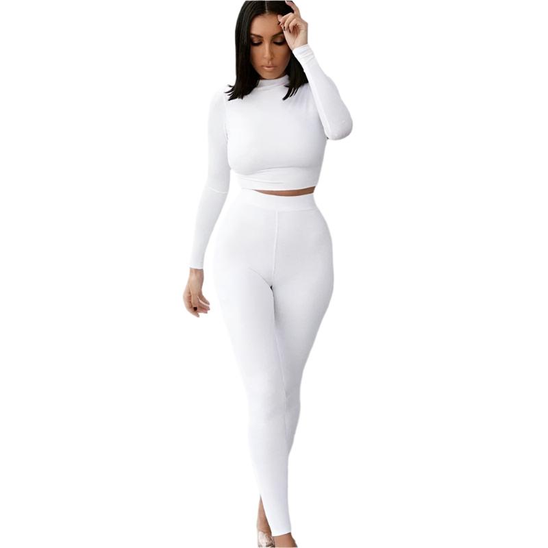 Damen Sportset Weiß XS, bestehend aus langärmligem Crop-Top und Leggings. Perfekt für Fitness, Yoga und Freizeit. Bequem und stilvoll.