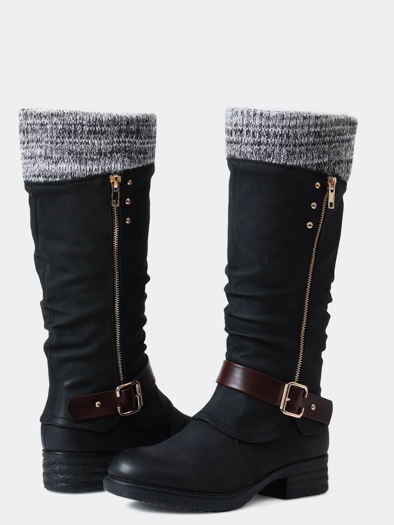 Schwarze Damenstiefel mit Strickbündchen, seitlichem Reißverschluss und Schnallen. Modische Winterstiefel, ideal für kalte Tage.